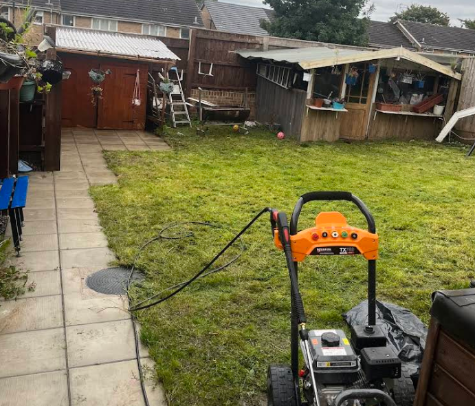 Professional jet washing equipment ready for a garden clean